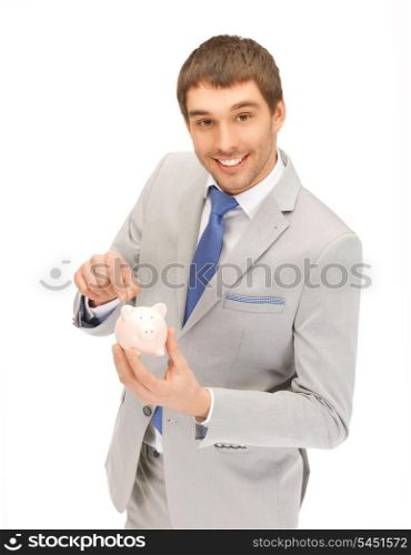 picture of handsome man with piggy bank...