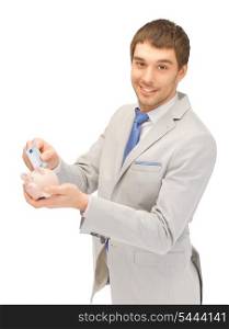 picture of handsome man with piggy bank and money
