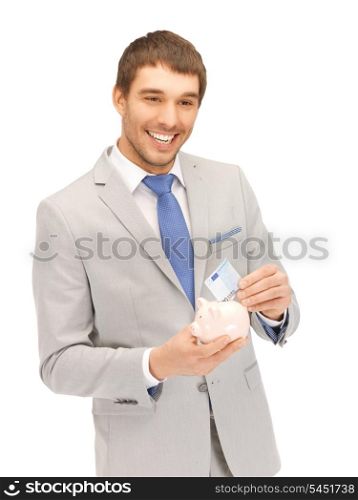 picture of handsome man with piggy bank and money....