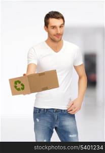 picture of handsome man with recyclable box
