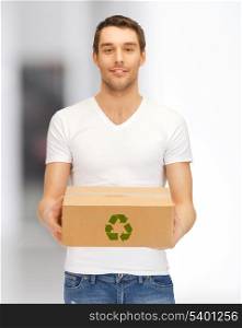 picture of handsome man with recyclable box