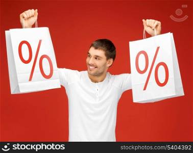 picture of handsome man with white shopping bags