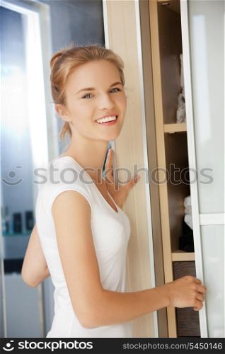 picture of happy and smiling teenage girl in a bathroom