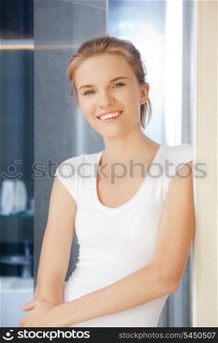 picture of happy and smiling teenage girl in a bathroom