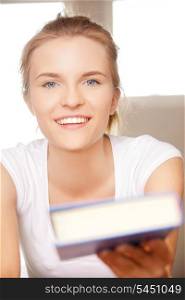 picture of happy and smiling teenage girl with book..