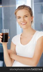 picture of happy and smiling teenage girl with glass of cola