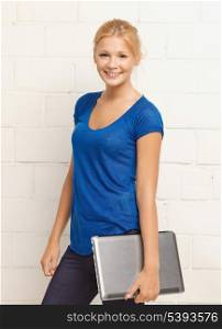 picture of happy and smiling teenage girl with laptop