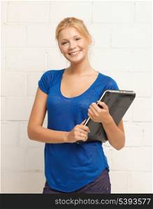 picture of happy and smiling teenage girl with laptop