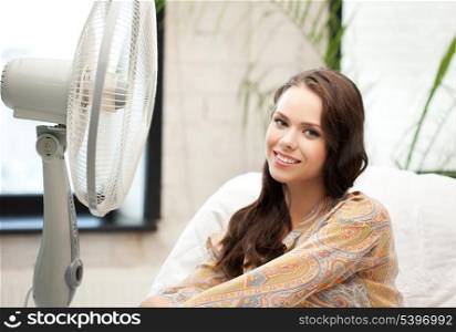 picture of happy and smiling woman sitting near ventilator