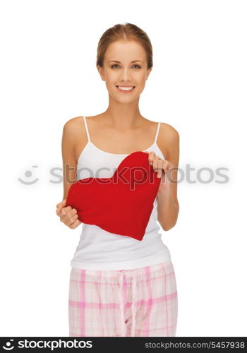 picture of happy and smiling woman with heart-shaped pillow