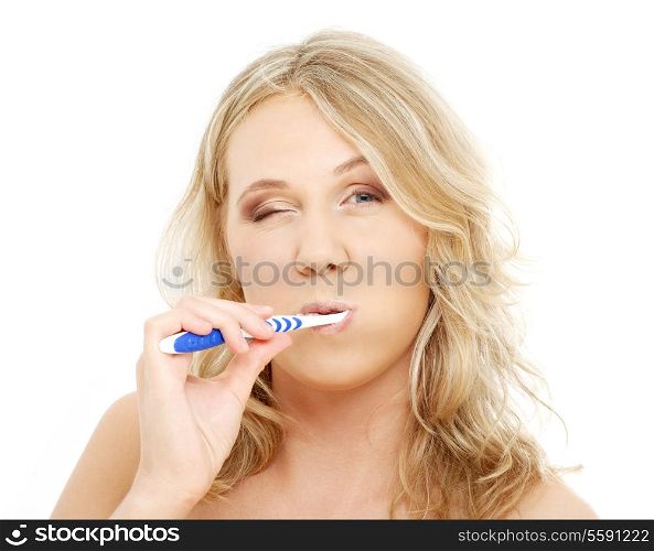 picture of happy blond with toothbrush over white