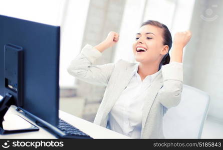 picture of happy businesswoman with computer in office. businesswoman with computer in office