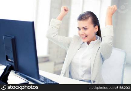 picture of happy businesswoman with computer in office. businesswoman with computer in office