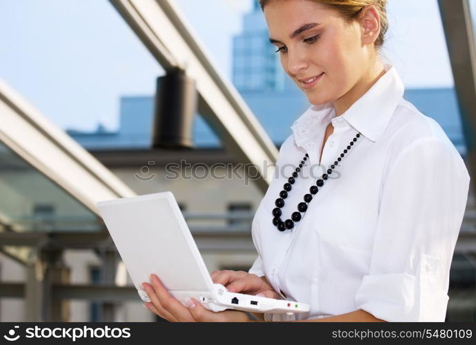 picture of happy businesswoman with laptop computer