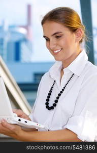 picture of happy businesswoman with laptop computer