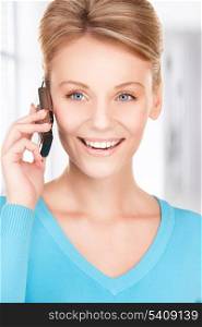 picture of happy businesswoman with phone in office