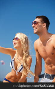 picture of happy couple in sunglasses on the beach.