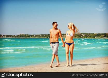picture of happy couple walking on the beach