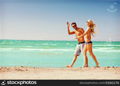 picture of happy couple walking on the beach