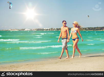 picture of happy couple walking on the beach.. couple walking on the beach