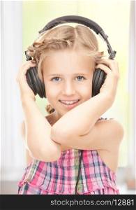 picture of happy girl in big headphones