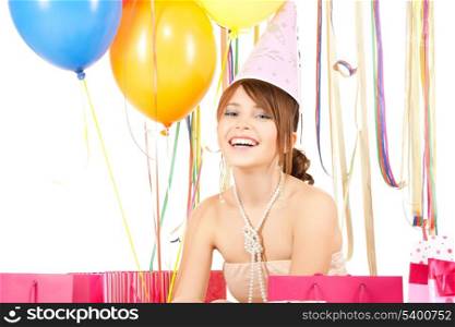 picture of happy girl with color balloons and gift bags