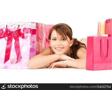 picture of happy girl with color gift bags