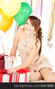 picture of happy girl with colorful balloons and gift boxes