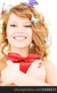 picture of happy girl with gift and butterflies over white