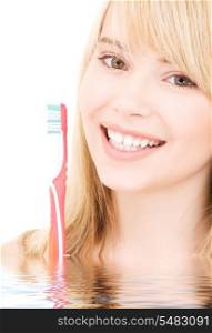 picture of happy girl with toothbrush in water