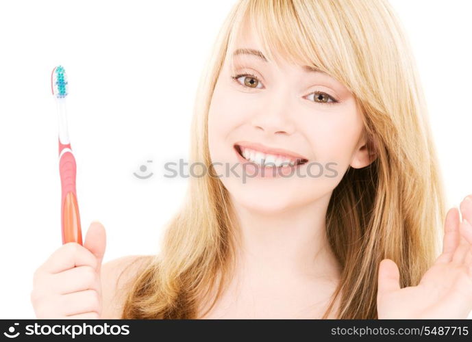 picture of happy girl with toothbrush over white