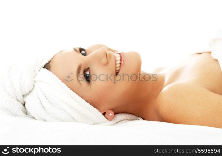 picture of happy lady relaxing in massage salon