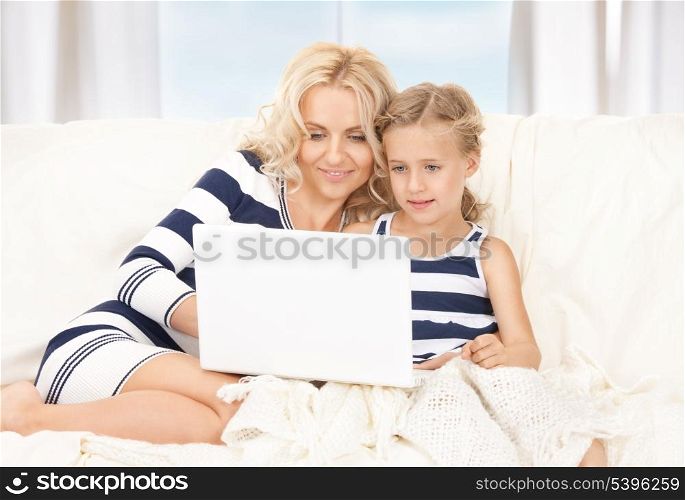 picture of happy mother and child with laptop computer