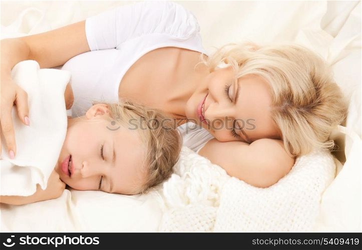 picture of happy mother and daughter sleeping
