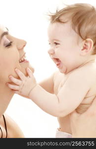 picture of happy mother with baby boy over white