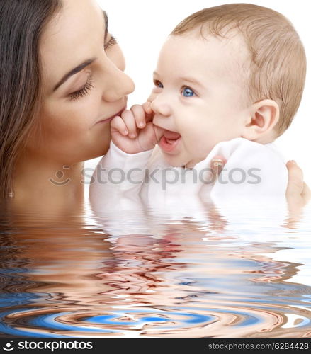 picture of happy mother with baby in water