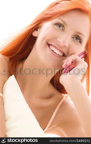 picture of happy redhead woman with cell phone