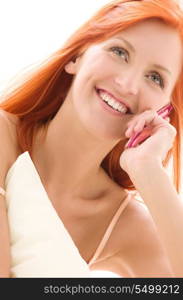 picture of happy redhead woman with cell phone