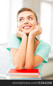 picture of happy smiling student girl with books