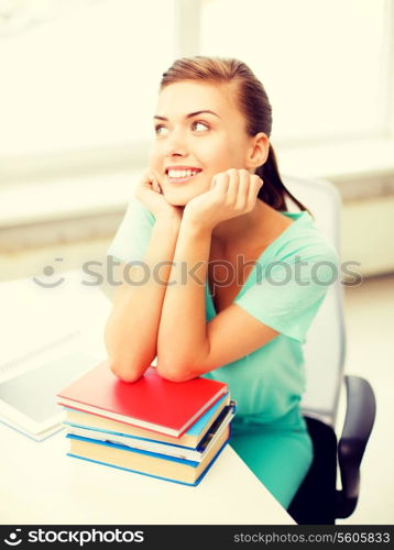 picture of happy smiling student girl with books