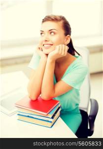 picture of happy smiling student girl with books