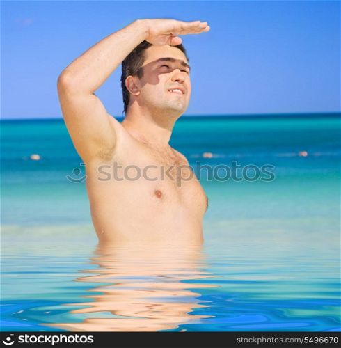 picture of happy tanned man on the beach