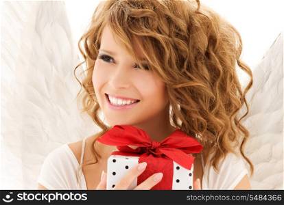 picture of happy teenage angel girl with gift over white
