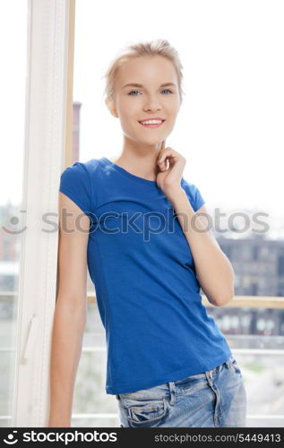 picture of happy teenage girl at the window