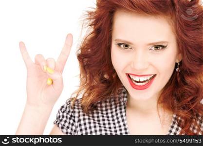 picture of happy teenage girl showing devil horns gesture