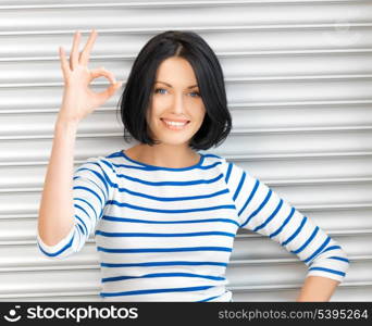 picture of happy teenage girl showing ok sign