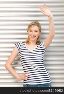 picture of happy teenage girl waving a greeting