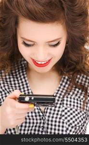 picture of happy teenage girl with digital camera