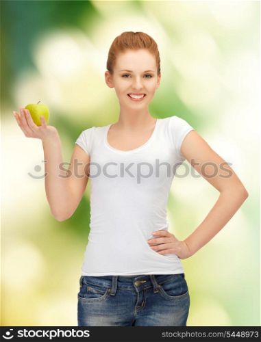 picture of happy teenage girl with green apple.