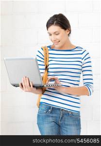 picture of happy teenage girl with laptop computer
